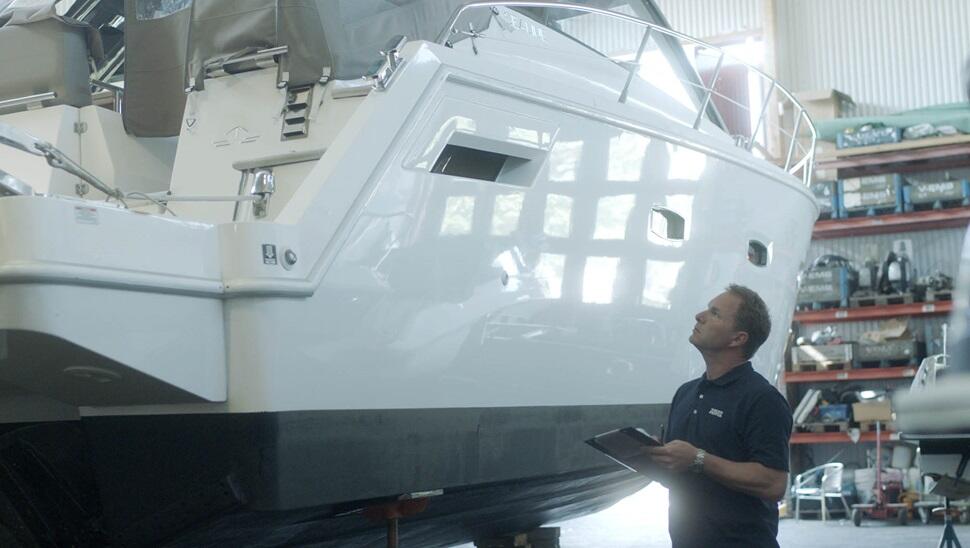 One of the brothers inspecting a boat